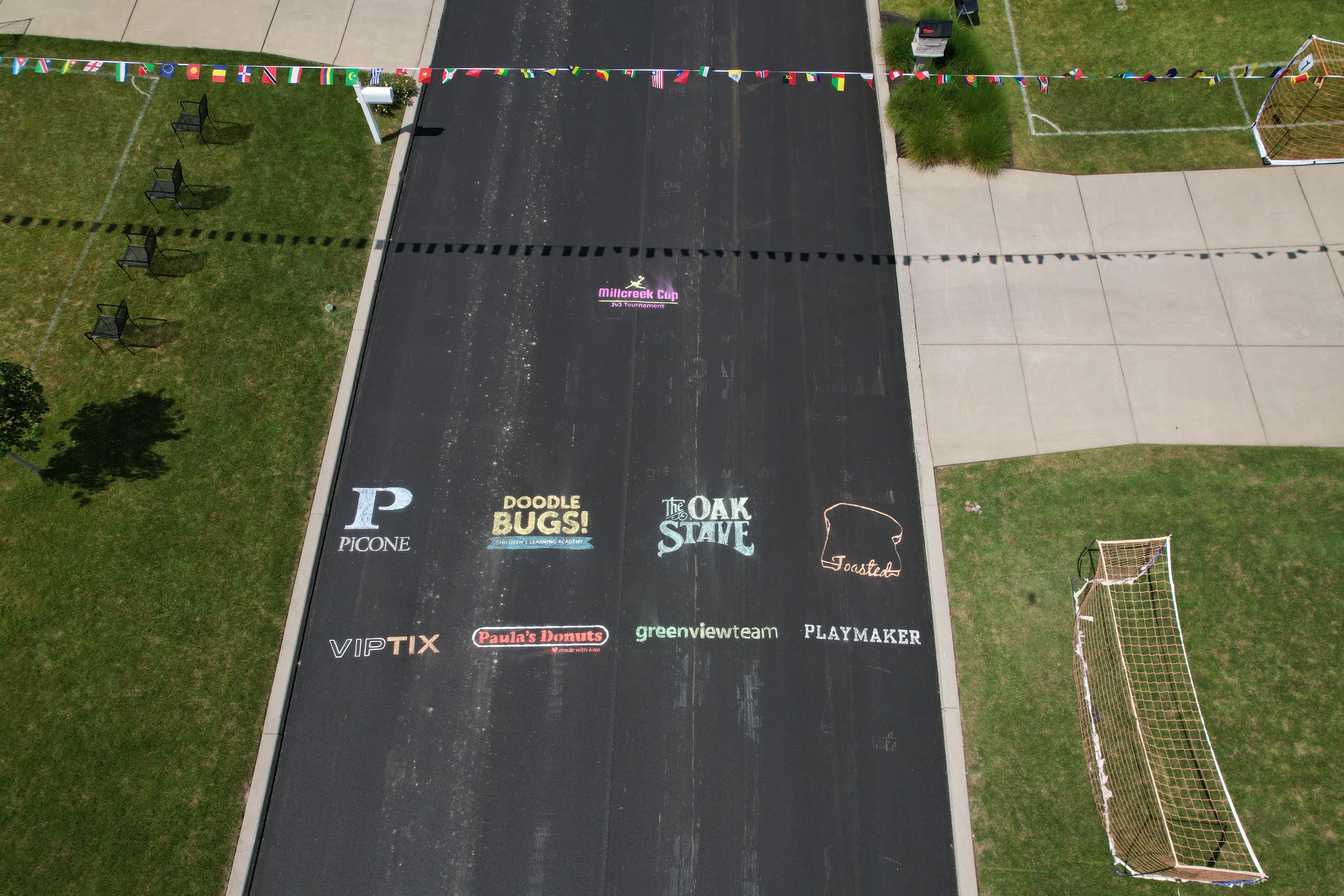 Aerial view of Millcreek Cup sponsor logos and front-yard fields
